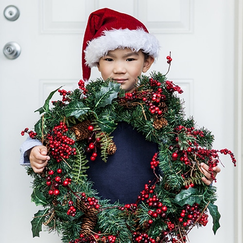 Boy Holding Holiday Wreath_Thumbnail